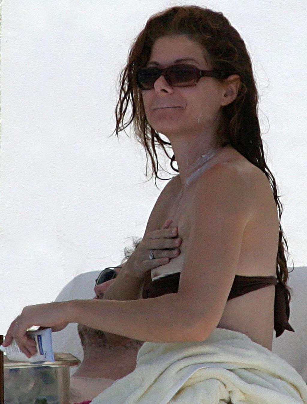 16P Debra Messing nipple slip on beach paparazzi pictures and posing nude