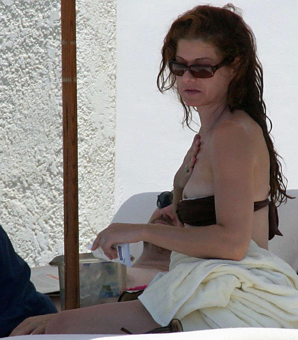 16P Debra Messing nipple slip on beach paparazzi pictures and posing nude