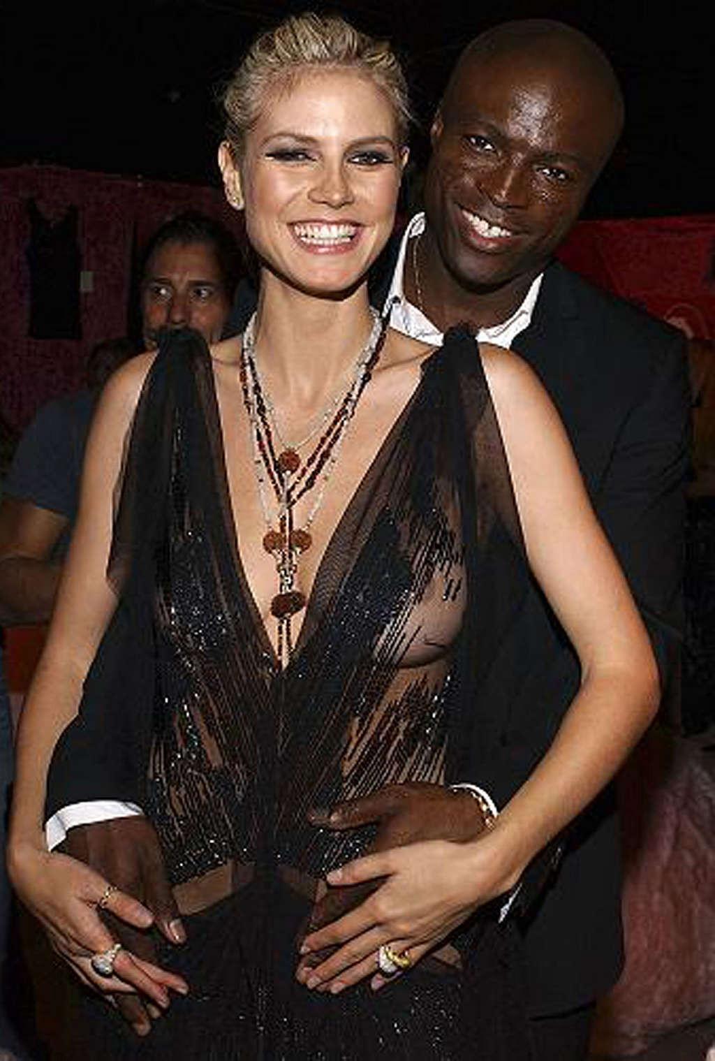 10P Heidi Klum posing all nude and topless on bike and see thru dress