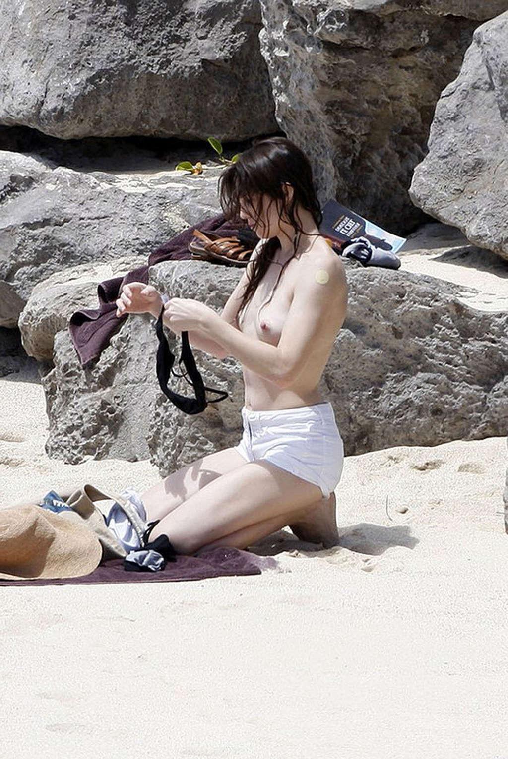 16P Charlotte Gainsbourg nude on the beach and shows ass in thong