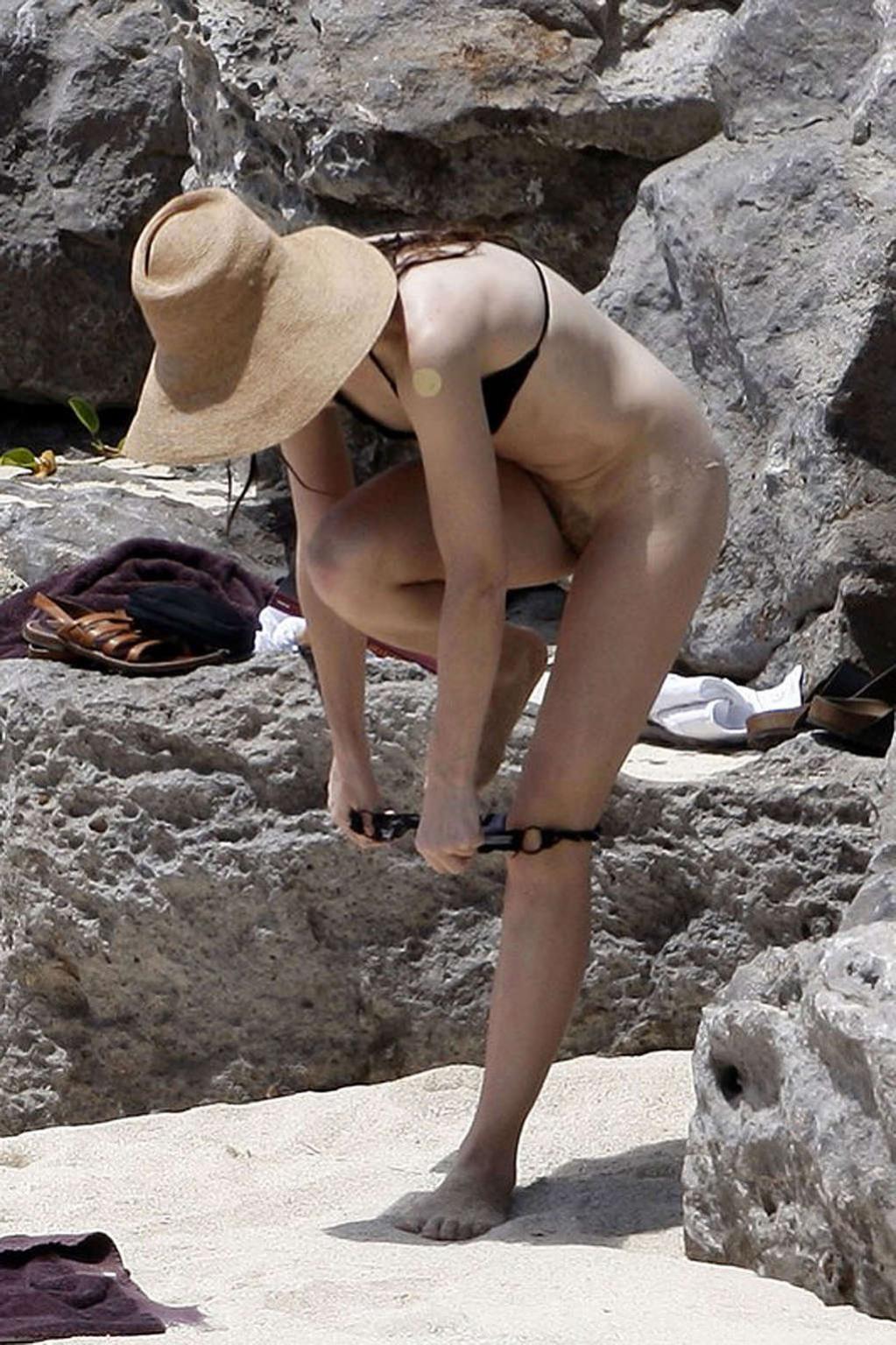 16P Charlotte Gainsbourg nude on the beach and shows ass in thong
