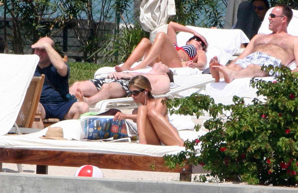 16P Jennifer Aniston showing her perfect and sexy ass in bikini on beach