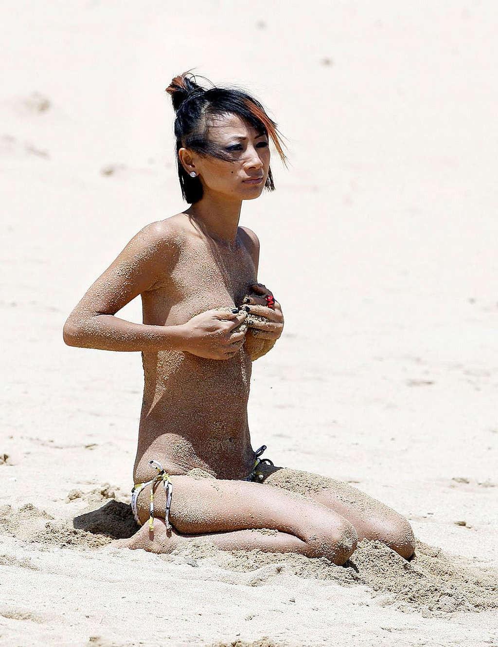 16P Bai Ling exposing her nice small tits and nipple slip paparazzi pictures