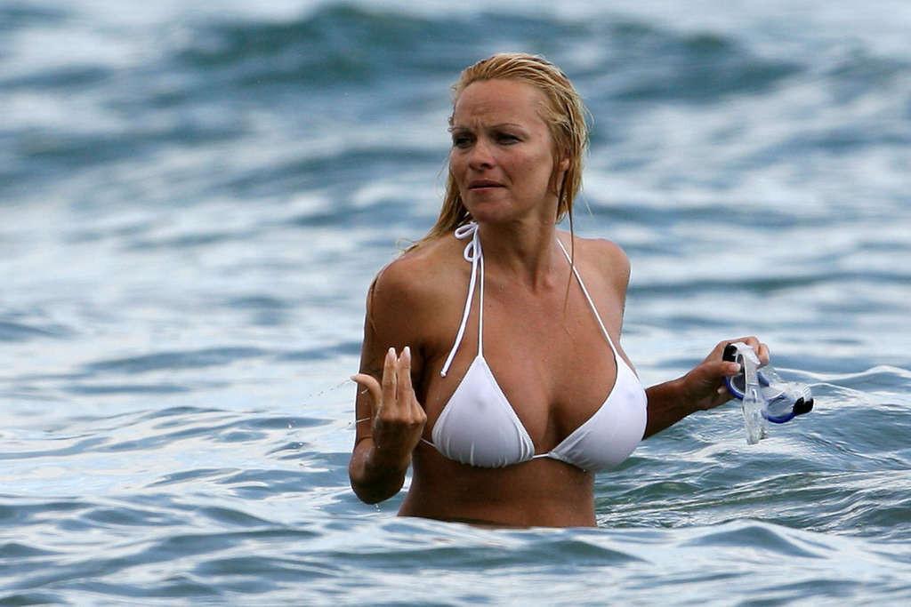 16P Pamela Anderson posing on beach and showing her nice body and sexy ass very hot 