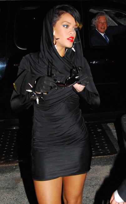 16P Rihanna wearing futuristic sunglasses at night