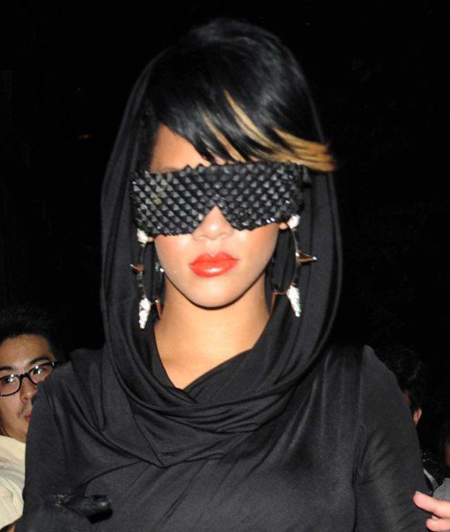 16P Rihanna wearing futuristic sunglasses at night