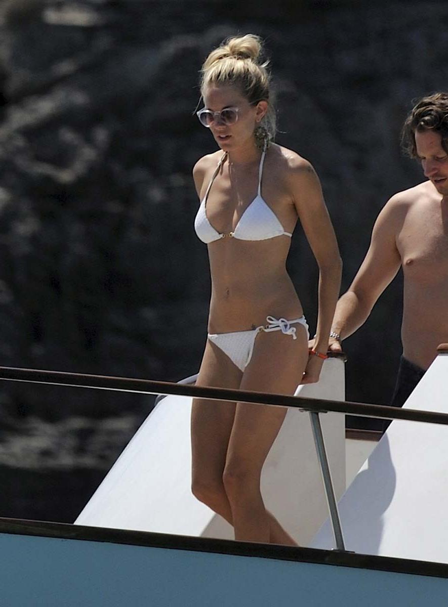 15P Sienna Miller sunbathing topless on the beach