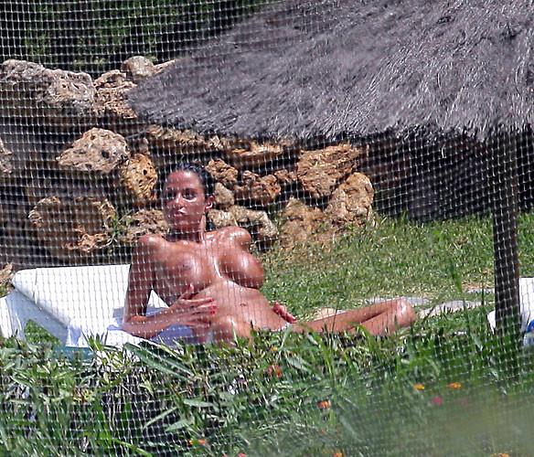 16P Katie Price Jordan exposing her big tits in pool paparazzi pictures