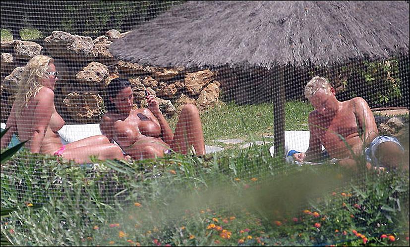 16P Katie Price Jordan exposing her big tits in pool paparazzi pictures