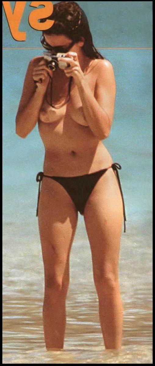 15P Penelope Cruz showing sweet topless on the beach
