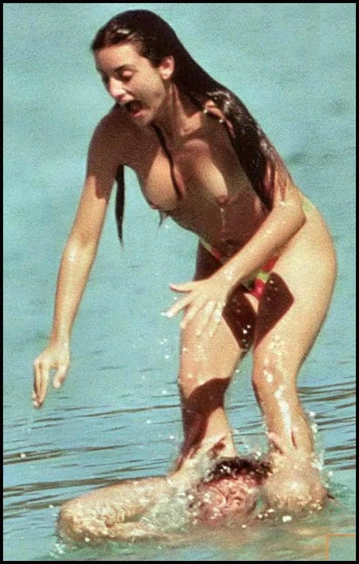 15P Penelope Cruz showing sweet topless on the beach