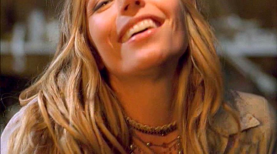 10P Andrea Bogart showing her nice big tits in some nude movie caps