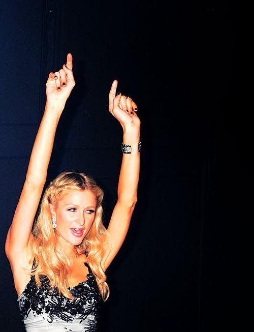 10P Paris Hilton showing her nice small tits and great legs in some photoshoot