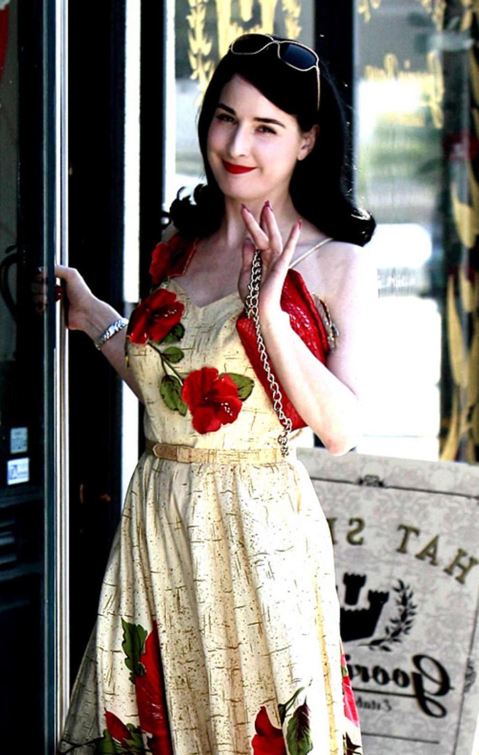 10P Dita Von Teese exposing her nice big tits and posing very sexy in stockings