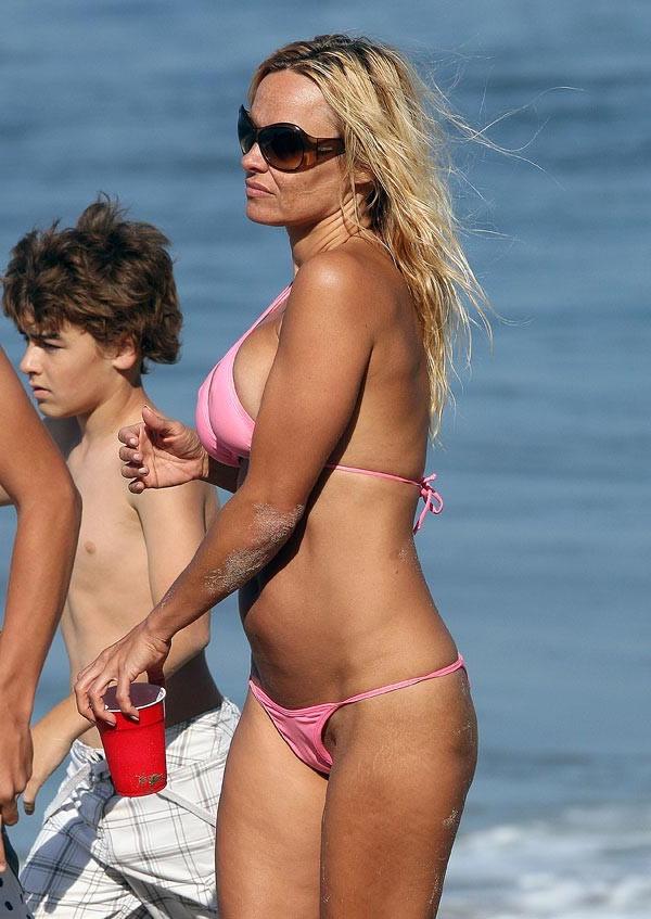 15P Pamela Anderson hot ass in thongs and shaved pussy