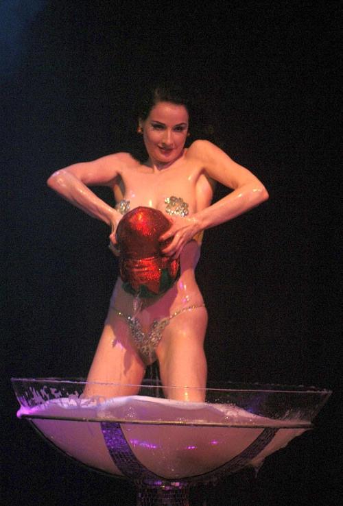 10P Dita Von Teese showing her nice tits and stripping off in some show