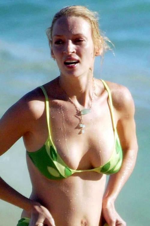 16P Uma Thurman showing her nice big tits on beach and posing in bikini