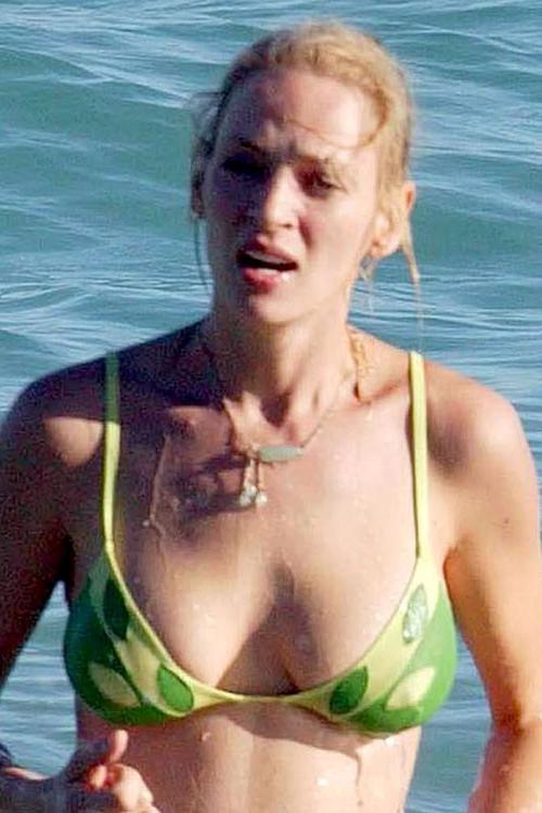 16P Uma Thurman showing her nice big tits on beach and posing in bikini