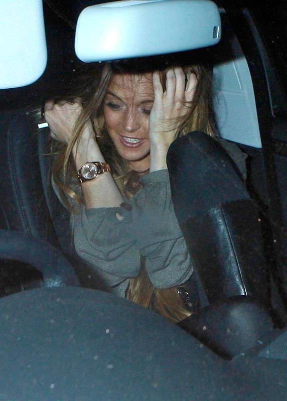 15P Celebrity Linday Lohan looking sexy and showing great legs