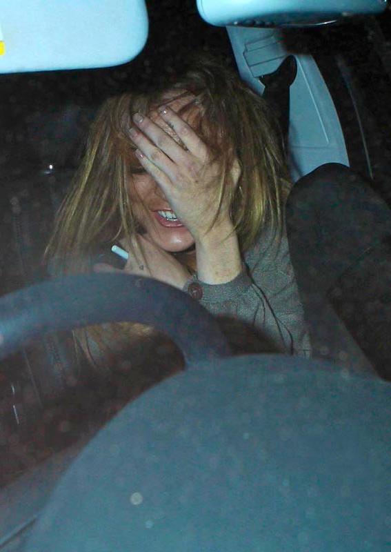 15P Celebrity Linday Lohan looking sexy and showing great legs