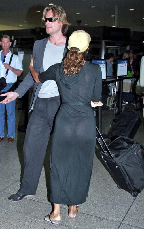 16P Halle Berry showing her nice big tits and ass in thong in see thru dress