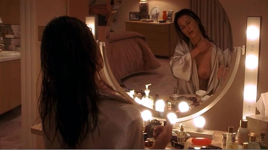 16P Rhona Mitra showing her nice big tits in mirror in some nude movie scenes