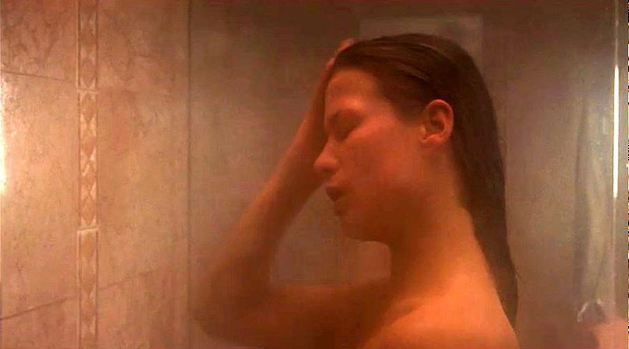 16P Rhona Mitra showing her nice big tits in mirror in some nude movie scenes