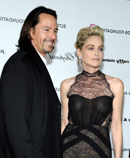 16P Sharon Stone showing her nice big tits on beach paparazzi pictures