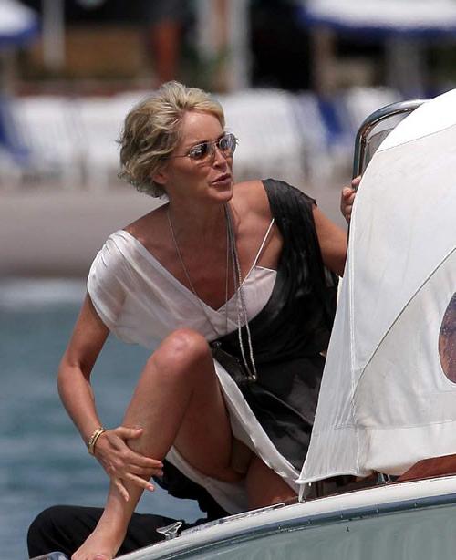 16P Sharon Stone showing her nice big tits on beach paparazzi pictures