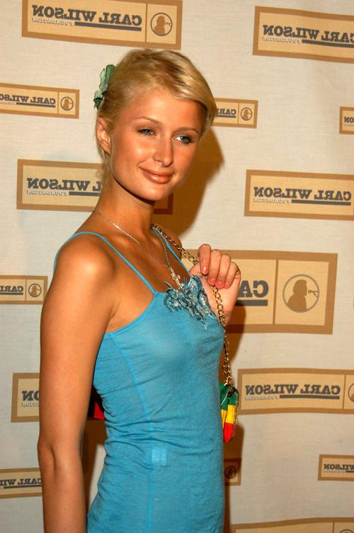 16P Paris Hilton showing her nice tits in see thru dress and her nice ass