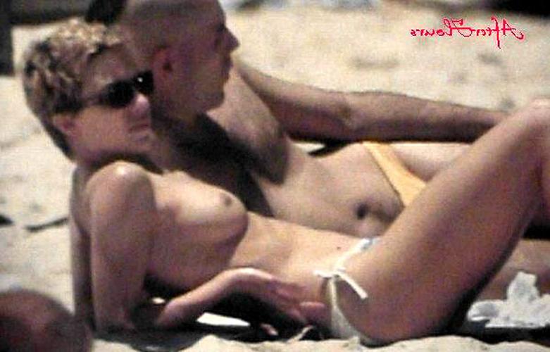 16P Kylie Minogue showing her nice small tits on beach