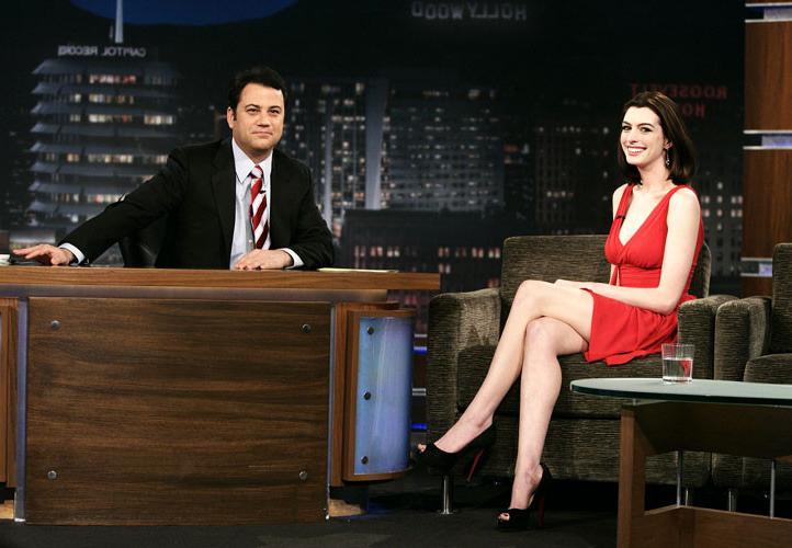 16P Anne Hathaway showing her legs in red mini skirt