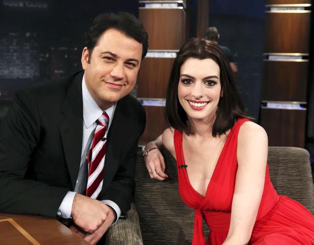 16P Anne Hathaway showing her legs in red mini skirt