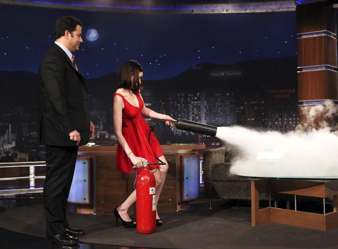 16P Anne Hathaway showing her legs in red mini skirt