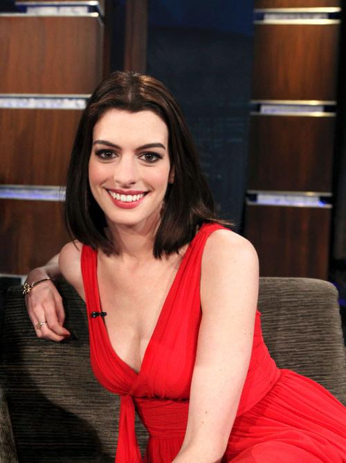 16P Anne Hathaway showing her legs in red mini skirt