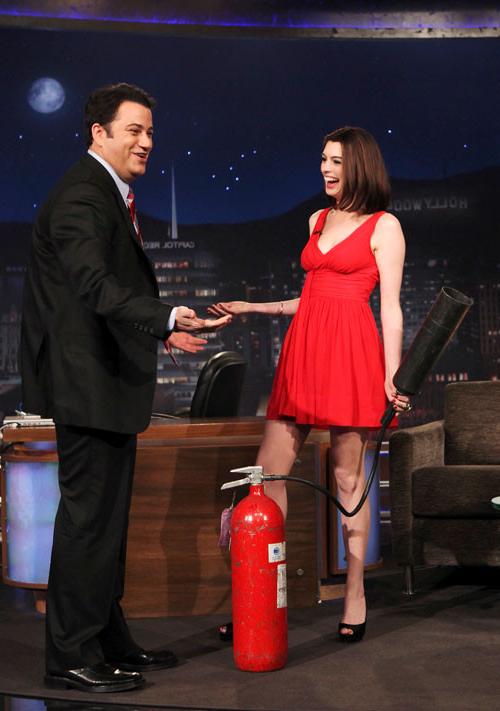 16P Anne Hathaway showing her legs in red mini skirt