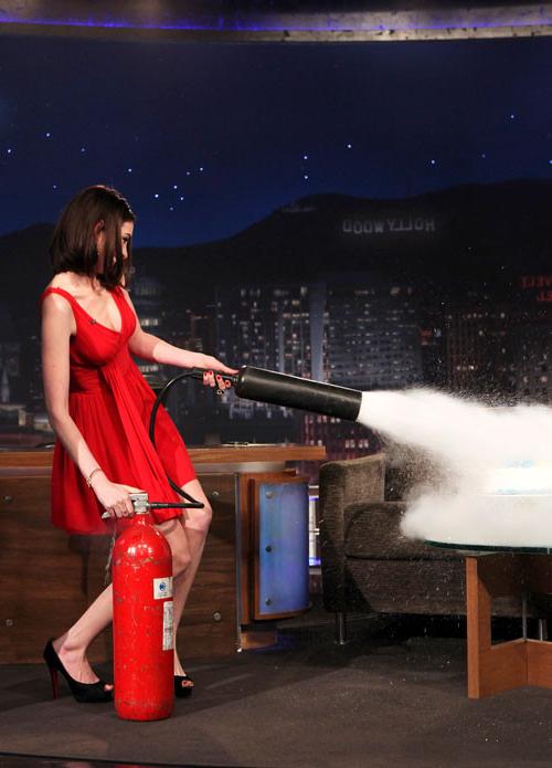 16P Anne Hathaway showing her legs in red mini skirt