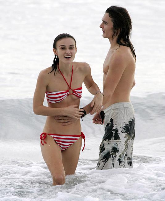 20P Amazing celebrity Keira Knightley nice nipple slip on the beach