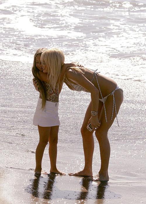 16P Paris Hilton showing her nice shaved pussy upskirt