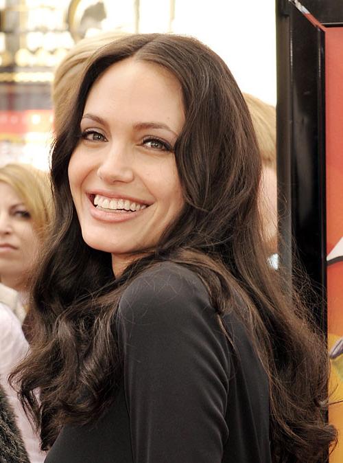 16P Angelina Jolie showing her long legs in mini skirt
