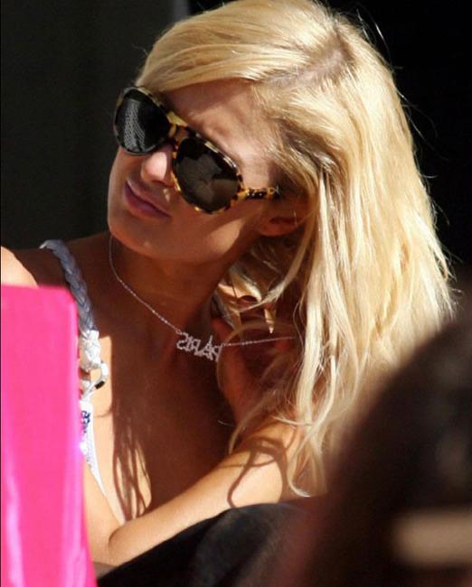 15P Celebrity Paris Hilton looking very sexy in cute fashion dress