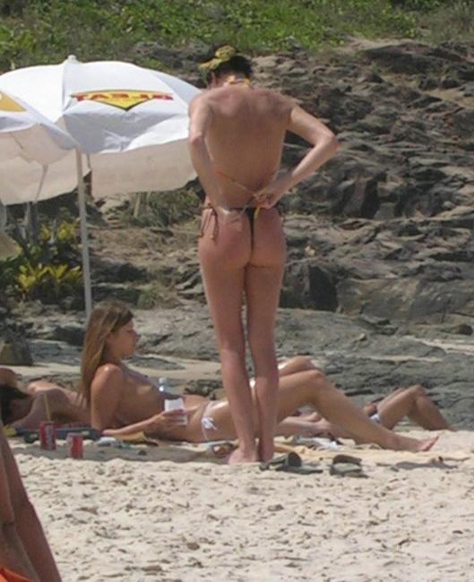 15P Busty celebrity Charlize Theron nice perky tits on the beach