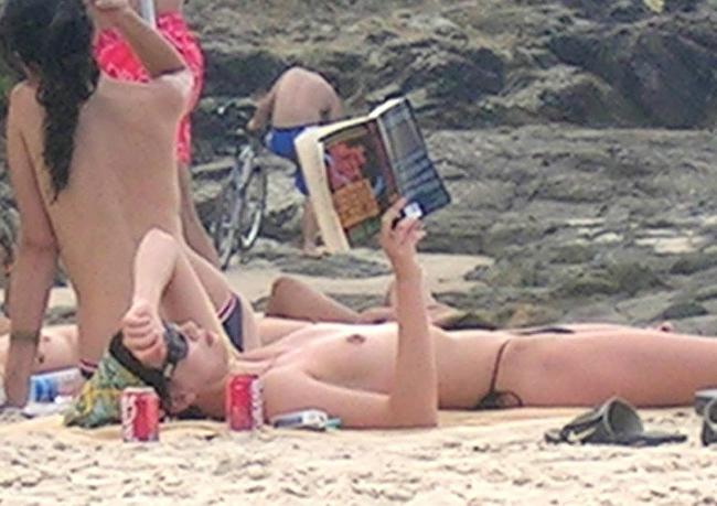 15P Busty celebrity Charlize Theron nice perky tits on the beach