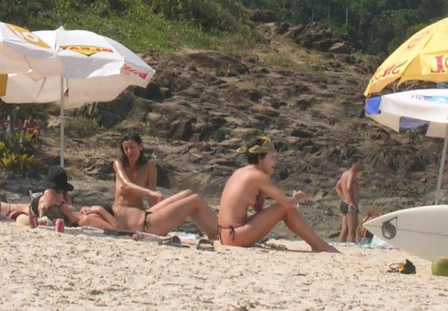 15P Busty celebrity Charlize Theron nice perky tits on the beach