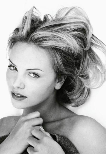 15P Busty celebrity Charlize Theron nice perky tits on the beach