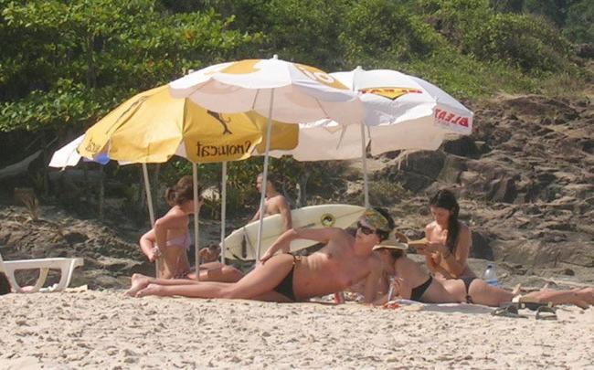 15P Busty celebrity Charlize Theron nice perky tits on the beach