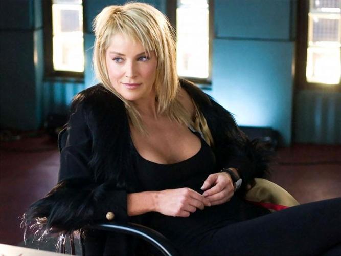 16P Sharon Stone showing her nice pussy and big tits on beach