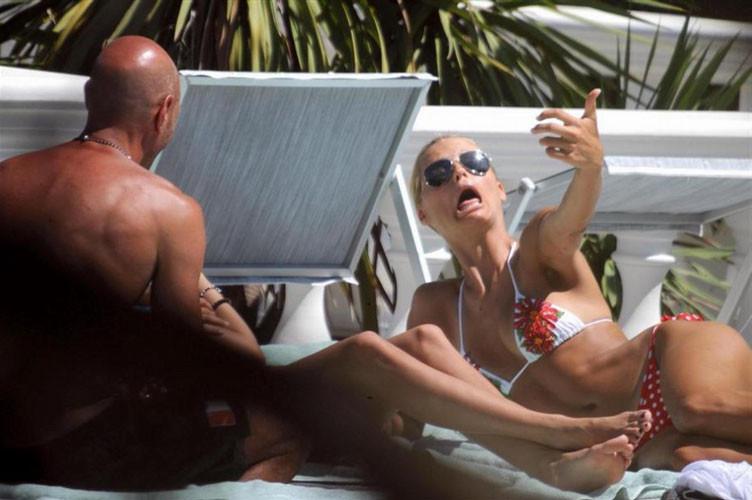 16P Michelle Hunziker showing her nice big tits and posing in thong