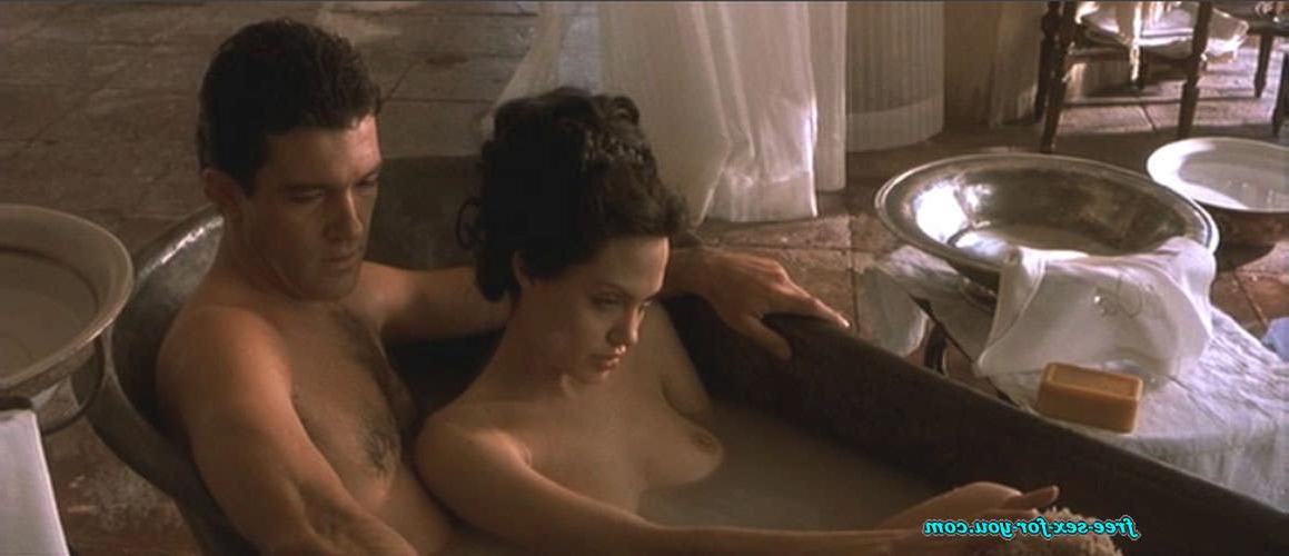 16P Angelina Jolie showing her nice big tits and fucking hard on bed