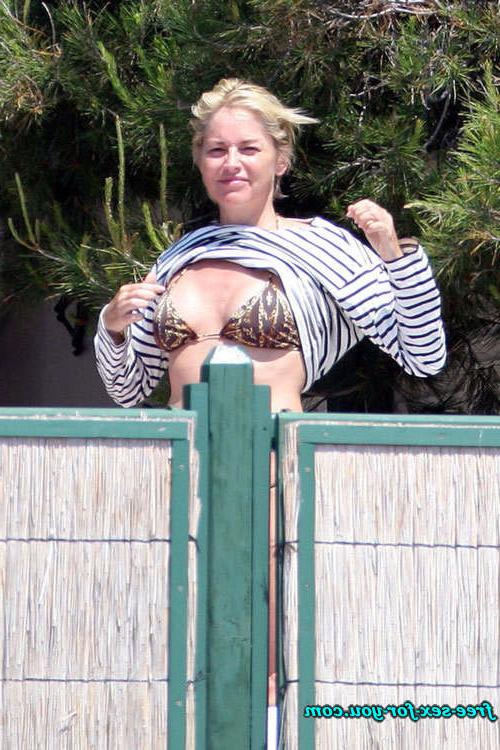 16P Sharon Stone showing her shaved pussy and big tits to paparazzi